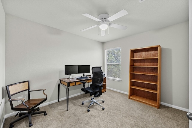 office featuring ceiling fan and light colored carpet