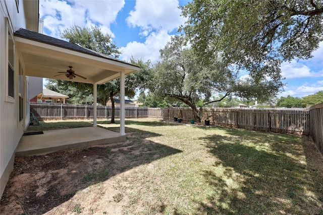 view of yard featuring ceiling fan and a patio area