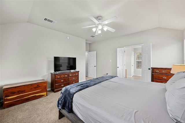 bedroom featuring ceiling fan, light colored carpet, and lofted ceiling