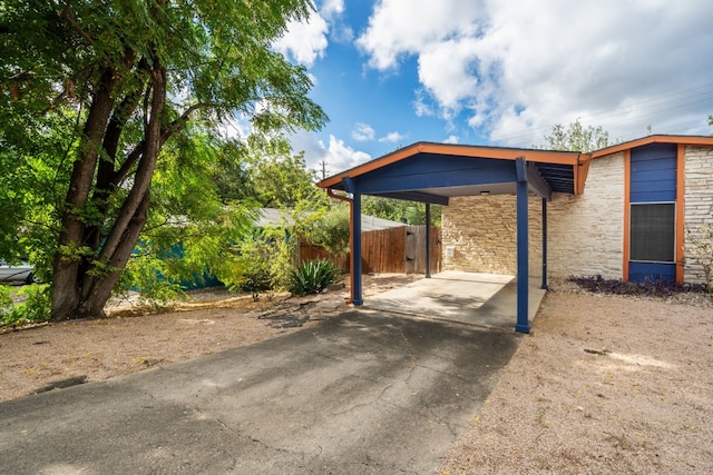 view of parking / parking lot with a carport