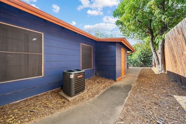 view of side of home featuring central AC unit