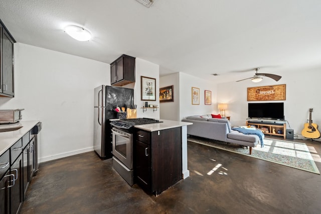 kitchen with ceiling fan, dark brown cabinetry, and stainless steel appliances