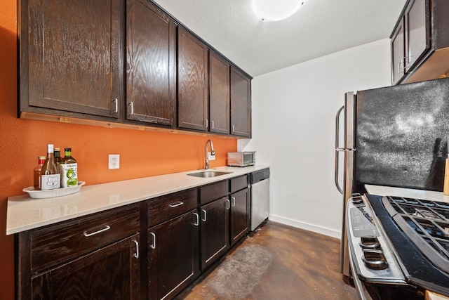 kitchen featuring stainless steel appliances, sink, and dark brown cabinets