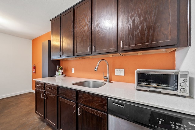 kitchen with dark brown cabinets, sink, and stainless steel dishwasher