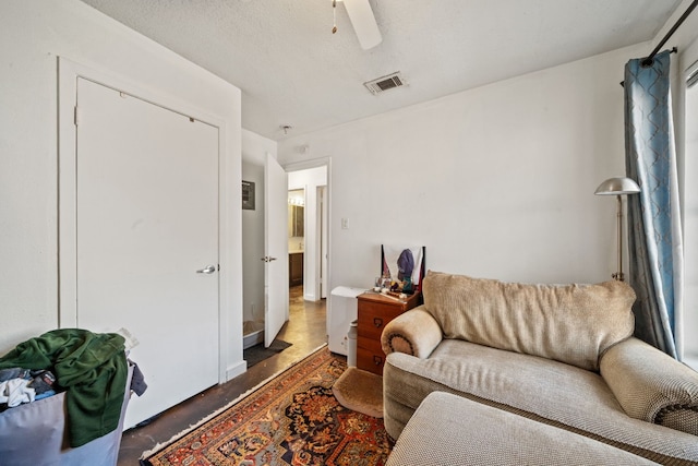 living area with ceiling fan