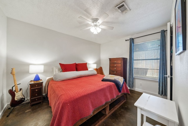 bedroom with a textured ceiling and ceiling fan