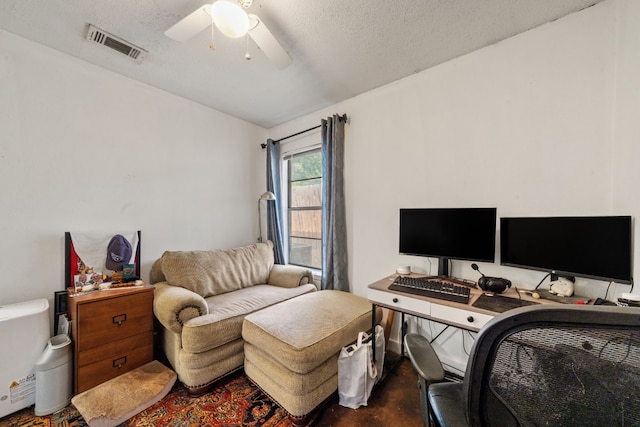 office with ceiling fan and a textured ceiling