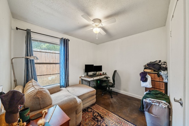 office space featuring ceiling fan and a textured ceiling