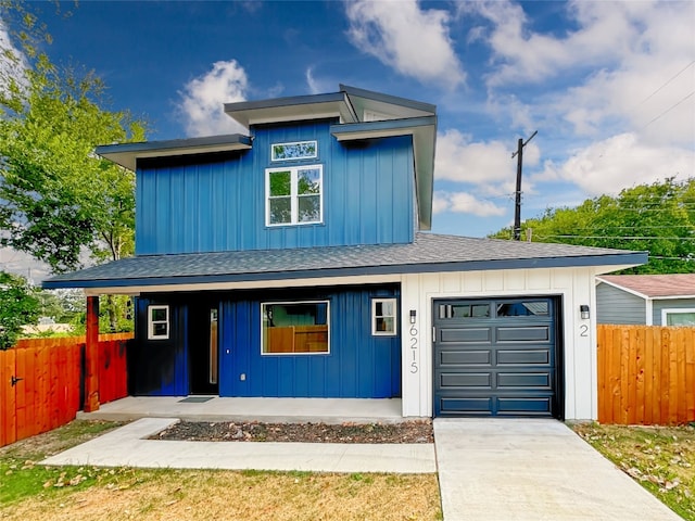 view of front of property with a garage and covered porch