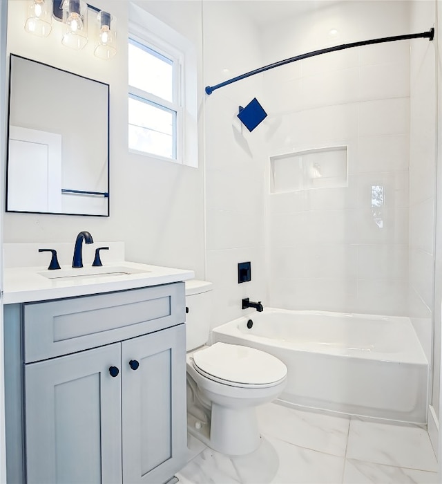 full bathroom with vanity, toilet, and tiled shower / bath combo