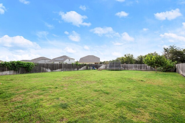 view of yard featuring a trampoline