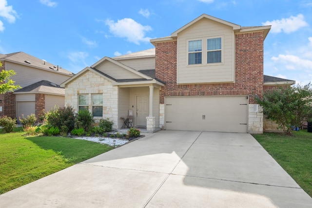 view of front of property with a front yard and a garage