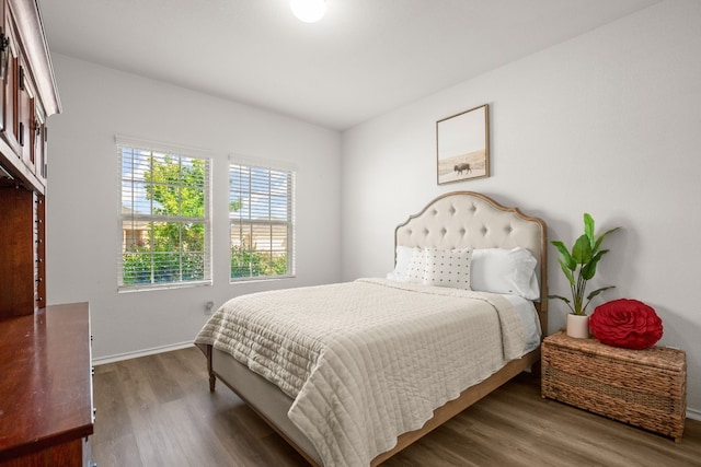 bedroom featuring dark hardwood / wood-style flooring