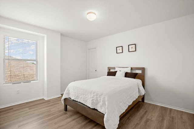 bedroom featuring hardwood / wood-style flooring