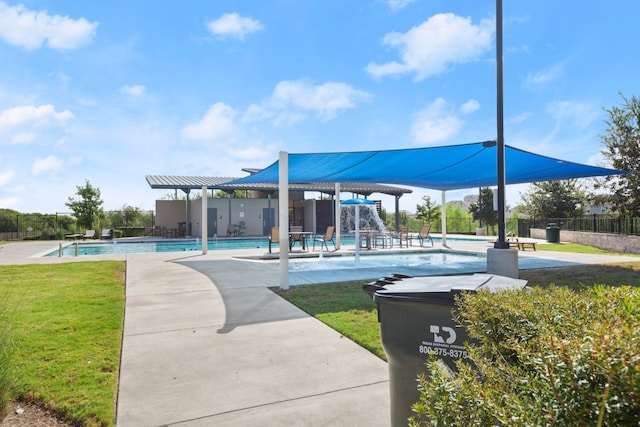 view of community featuring a lawn, a pergola, a swimming pool, and a patio area