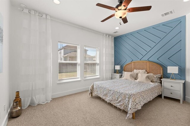 carpeted bedroom with ceiling fan