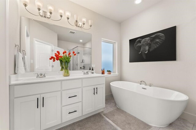 bathroom with vanity, separate shower and tub, and tile patterned floors