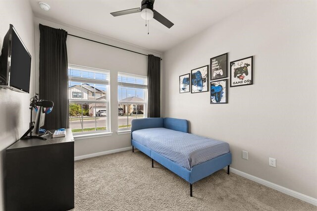 carpeted bedroom featuring ceiling fan