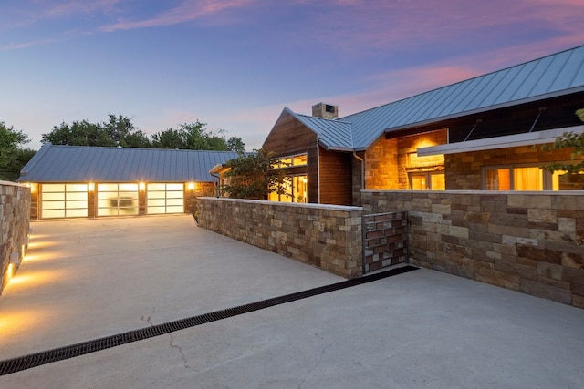 view of patio terrace at dusk