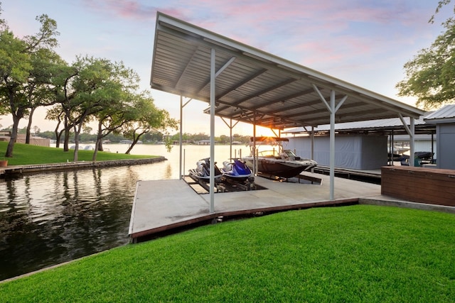 dock area featuring a water view and a yard