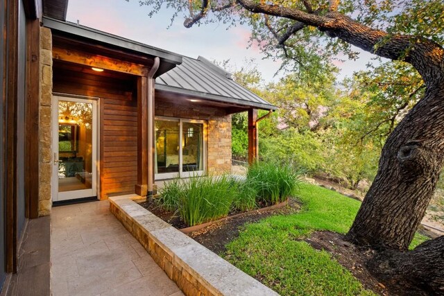 view of property exterior at dusk