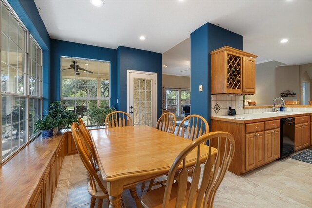 dining space with sink and ceiling fan