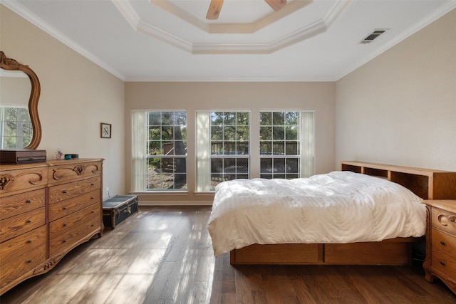 bedroom with ceiling fan, dark hardwood / wood-style flooring, and multiple windows