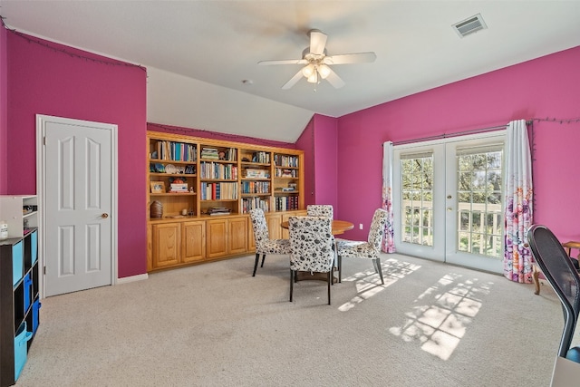 interior space featuring lofted ceiling, ceiling fan, and french doors