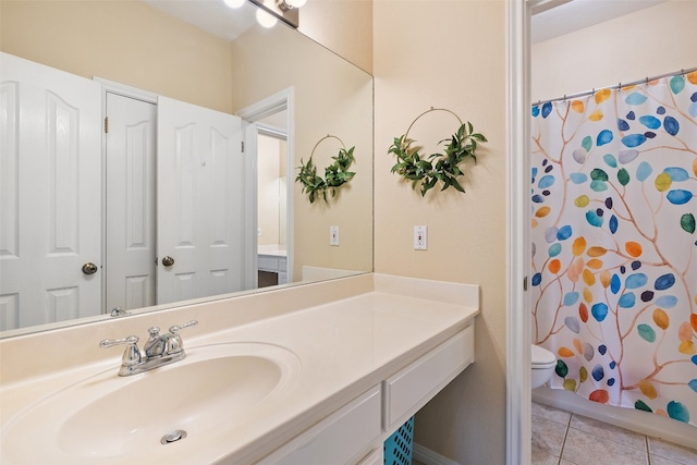 bathroom featuring walk in shower, tile patterned flooring, vanity, and toilet