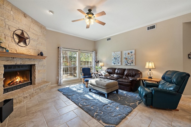 living room with a fireplace, ornamental molding, and ceiling fan