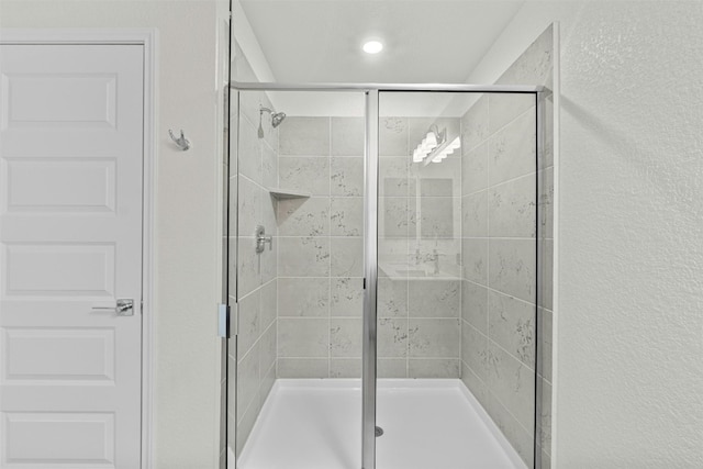 bathroom featuring an enclosed shower