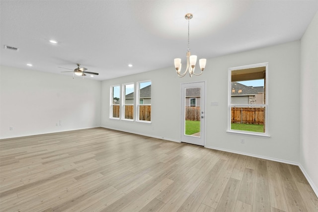 1721 Tin Can Trl, Georgetown, TX 78628 - unfurnished room featuring light wood-style flooring, a chandelier, recessed lighting, a ceiling fan, and baseboards