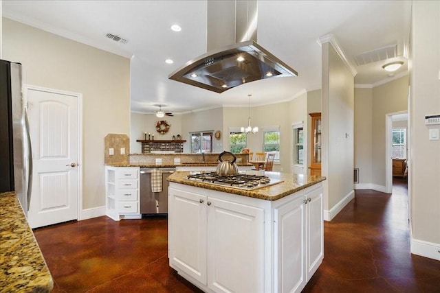 kitchen featuring light stone countertops, white cabinetry, stainless steel appliances, island exhaust hood, and ornamental molding