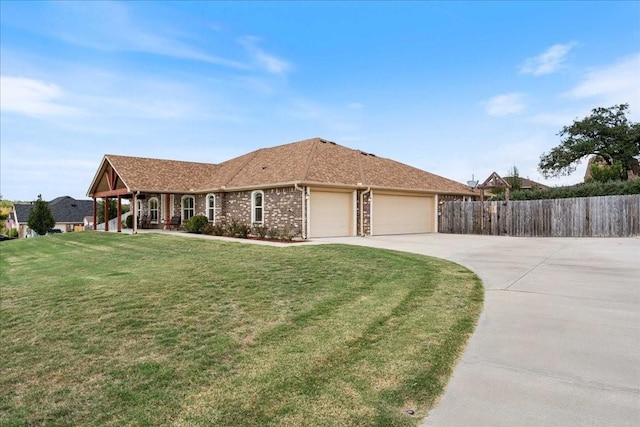 ranch-style house with a garage and a front yard