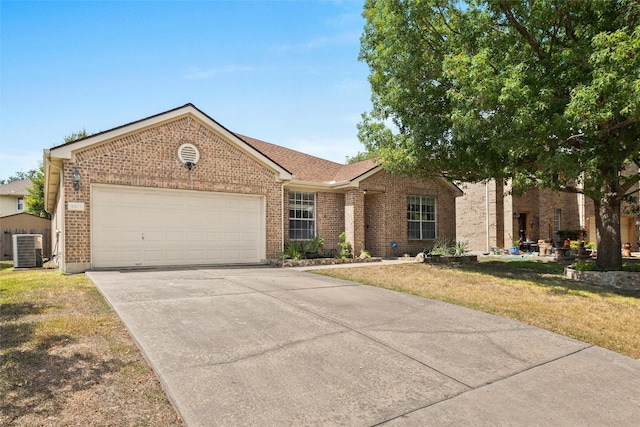 ranch-style house with cooling unit, a garage, and a front lawn