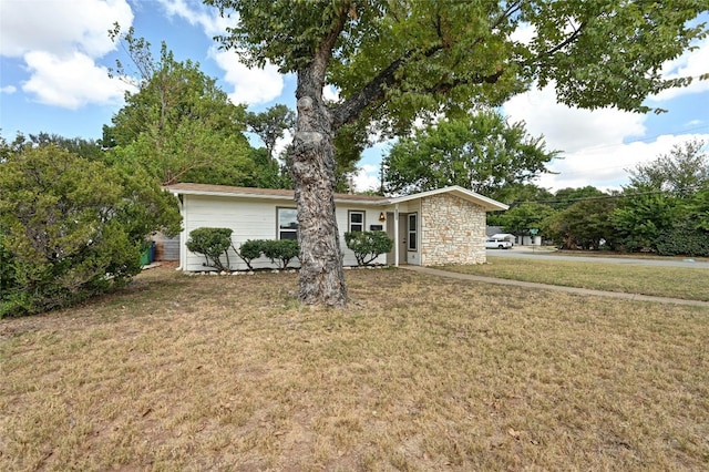 1130 Gardner Rd, Austin, TX 78721 - view of front of house with a front lawn and stone siding