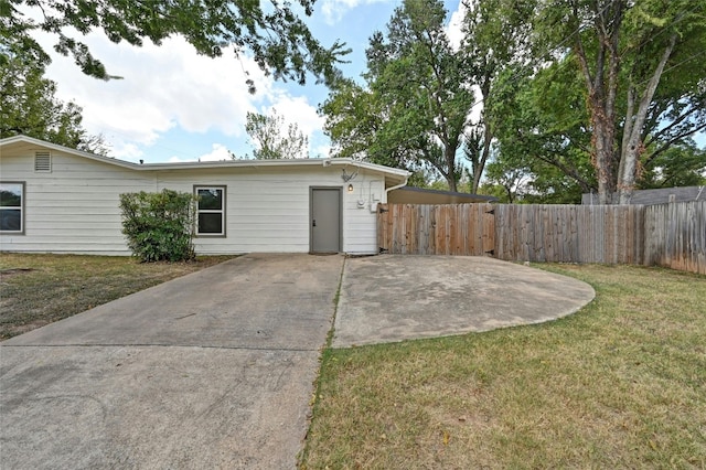 exterior space featuring a patio and a lawn