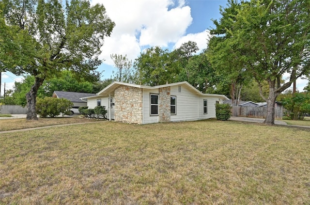 view of side of property featuring a yard