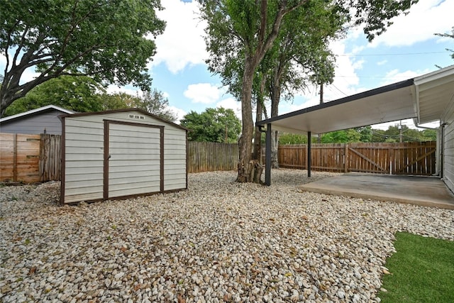 view of yard with a shed and a patio