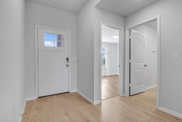 foyer with light hardwood / wood-style floors