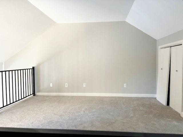 5608 Cougar Dr Unit 219, Austin, TX 78745 - additional living space with lofted ceiling, carpet flooring, and baseboards