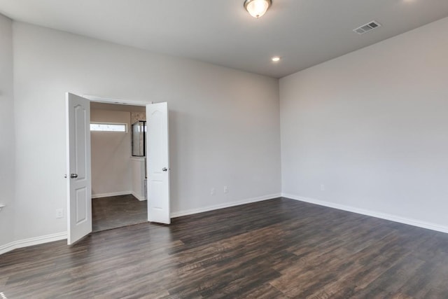 509 Oleander Loop, Buda, TX 78610 - spare room with baseboards, visible vents, dark wood-style flooring, and recessed lighting