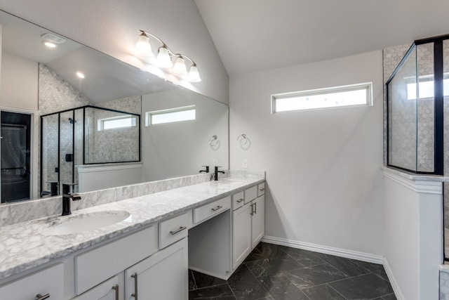 bathroom with vaulted ceiling, an enclosed shower, and vanity