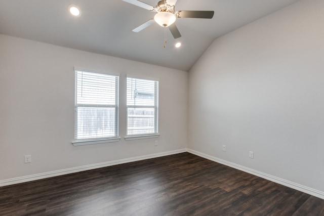 spare room with ceiling fan, lofted ceiling, and dark hardwood / wood-style flooring