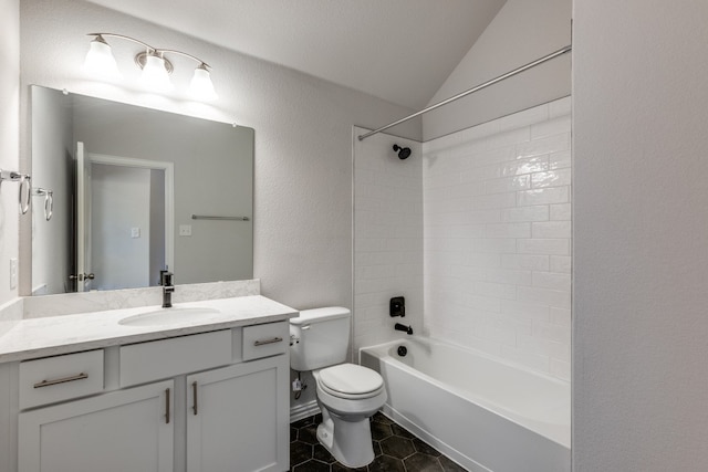 full bathroom featuring tiled shower / bath, vanity, toilet, tile patterned floors, and vaulted ceiling