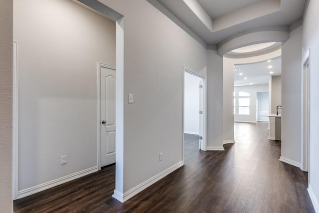 509 Oleander Loop, Buda, TX 78610 - hallway featuring dark wood finished floors and baseboards