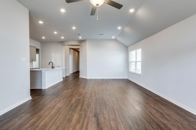509 Oleander Loop, Buda, TX 78610 - unfurnished living room with dark wood-type flooring, a ceiling fan, recessed lighting, and baseboards