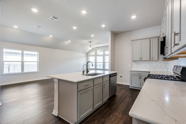 kitchen featuring a center island with sink, appliances with stainless steel finishes, plenty of natural light, and sink