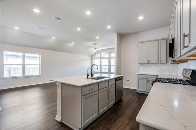 509 Oleander Loop, Buda, TX 78610 - kitchen featuring gray cabinetry, stainless steel appliances, an island with sink, and a sink