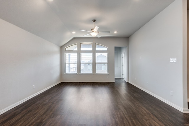 unfurnished living room featuring ceiling fan, vaulted ceiling, and dark hardwood / wood-style flooring